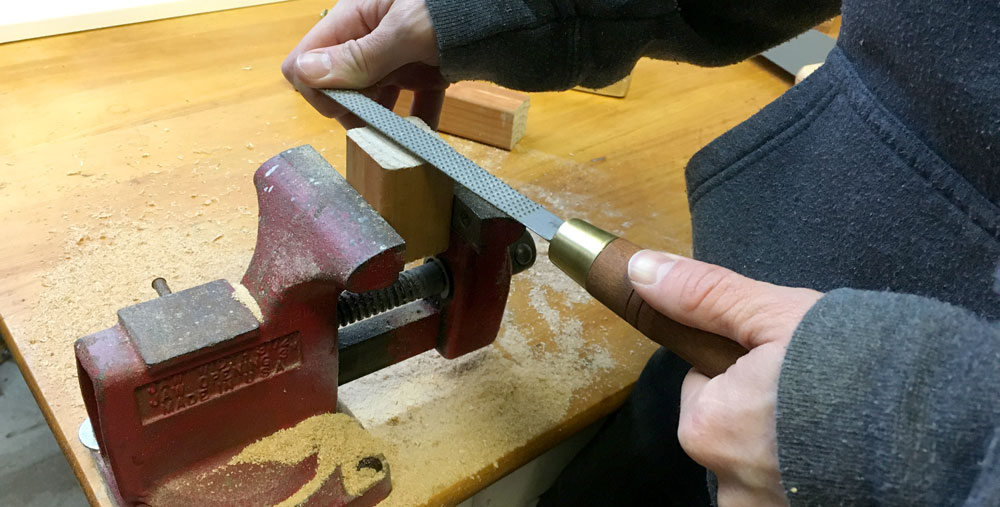 Rasping a small piece of wood