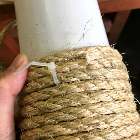 Zip-tying sisal segments to build a cat tree