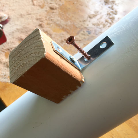 Screwing a small metal L bracket to a PVC pipe